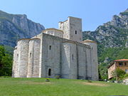 San Vittore alle Chiuse, Genga, Italy, of undressed stone, has a typically fortress-like appearance.