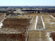 An aerial view of the Toronto/Markham Airport, a small airport, in the winter.
