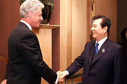 Greeting United States President Bill Clinton (left) at APEC meeting in Auckland, September 12, 1999.