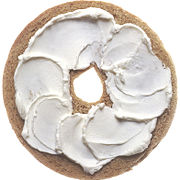 Half a bagel spread with cream cheese.