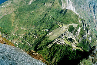 View of Machu Picchu from Huayna Picchu, showing buses carrying tourists to and from the town of Aguas Calientes