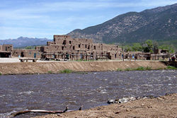 Taos Pueblo with Rio Pueblo in foreground