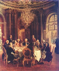 Voltaire in the court of  Frederick II of Prussia. Voltaire is depicted to the left. Painting by Adolph von Menzel, 1750.