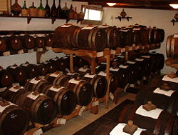 Barrels of balsamic vinegar aging in a maker's attic, an example of the slow method of fermentation