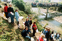 People wait in line to gather water, during the Siege of Sarajevo.