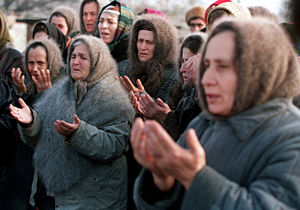 Chechen elderly women pray.