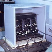 Three phase dry-type transformer with cover removed; rated about 200 KVA, 480 V.