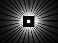 Wall-mounted light with shadows.