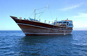 Dhow in Gulf of Aden, April 30, 2005. A dhow, whose origin is Arabia, is a little wood-made coaster.