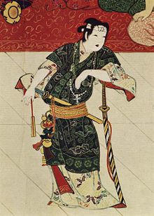 Kabuki founder Izumo no Okuni, wearing a samurai sword and a Christian cross