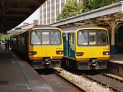 Two British Rail Class 143 DMUs at Cardiff Queen Street station in the United Kingdom.