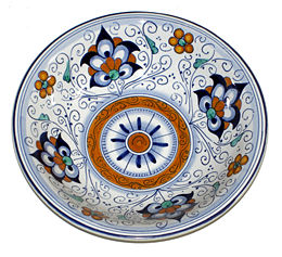 Fine tin-glazed earthenware (maiolica) in traditional pattern, made in Faenza.