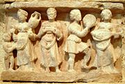 Hellenistic culture in the Indian subcontinent: Greek clothes, amphoras, wine and music (Detail of Chakhil-i-Ghoundi stupa, Hadda, Gandhara, first century C.E.).
