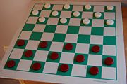 A standard American Checkers Federation set