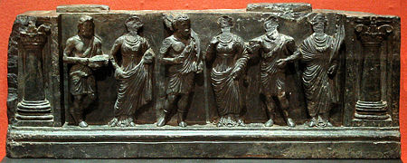 Greek Buddhist devotees, holding plantain leaves, in purely Hellenistic style, inside Corinthian columns, Buner relief, Victoria and Albert Museum.