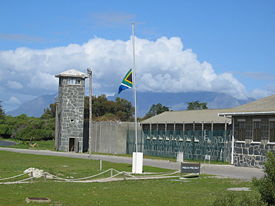 Prison buildings on Robben Island. Table Mountain some 15 km in the background