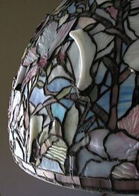 Drapery glass incorporated in a reproduction of Tiffany's "Magnolia" lampshade