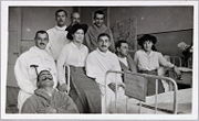 Grand Duchess Maria Nikolaevna, left, and Grand Duchess Anastasia Nikolaevna pose with wounded soldiers while visiting their hospital in about 1915. Courtesy: Beinecke Library