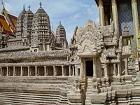 A model of Angkor Wat prior to its decline shows the half-galleries of the lower level and intact towers at the corners of the second-level galleries.