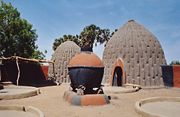 The homes of the Musgum, in the Far North Province, are made of earth and grass.