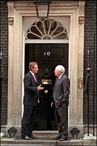 Tony Blair and Dick Cheney at the main door to 10 Downing Street, the Prime Minister's residence in London, on March 11, 2002.