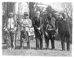 U.S. President Calvin Coolidge with four Osage Indians after Coolidge signed the bill granting Indians full citizenship.