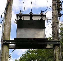 Three-phase pole-mounted step-down transformer.