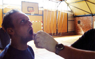 Taking a saliva sample for testing