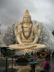 A large statue in Bangalore depicting Shiva meditating