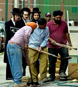 Haredi Jews with Gentile workmen